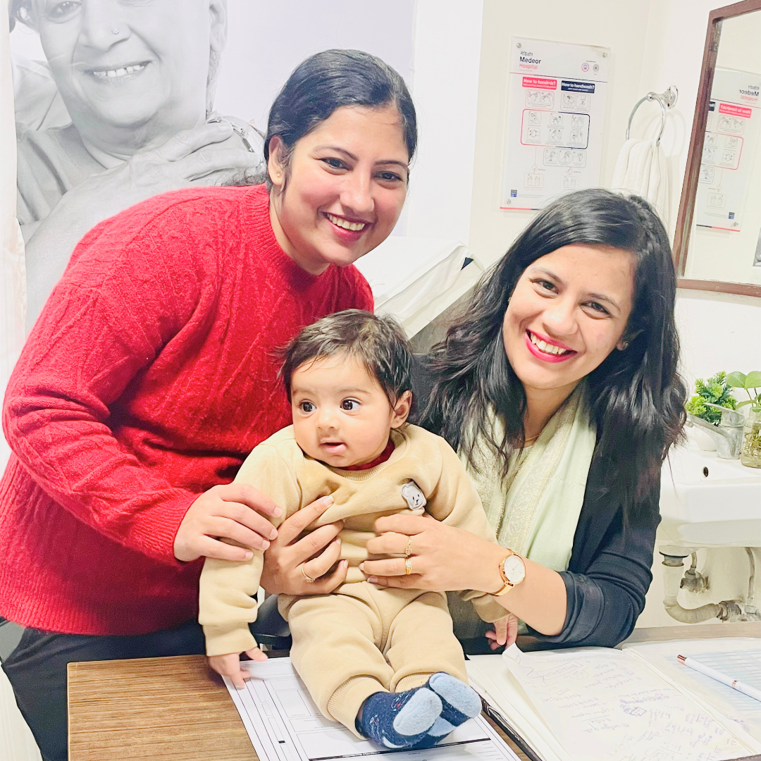 Happy patient family with Dr. Megha Panwar after safe delivery